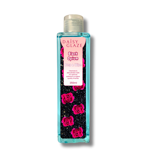 Daisy Glaze Black Opium prep & wipe bottle with pink roses on a white background